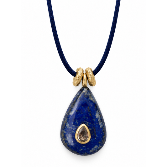 Close-up of Bote A Mano blue Lapis Lazuli teardrop pendant with 24K gold-plated details