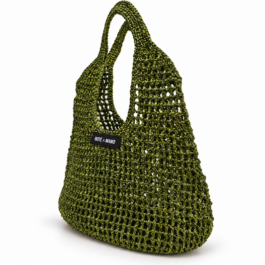 Full view of the dark green bucket bag showing the full size, drawstring top closure, and elegant seasonal silhouette.