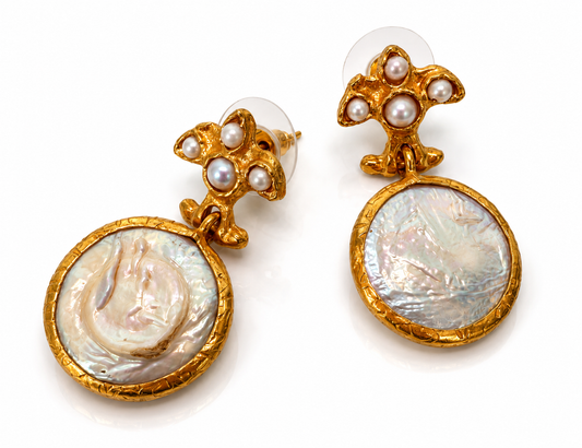 Side view of 24K gold-plated mother of pearl earrings showing handcrafted texture and lightweight drop design by Bote A Mano.