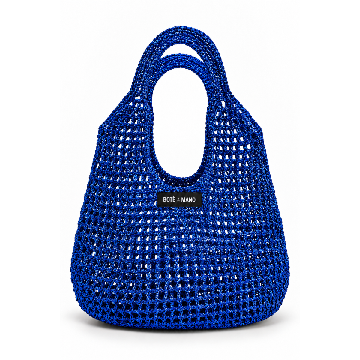 Blue woven handbag with 'Boté a Mano' label on a white background