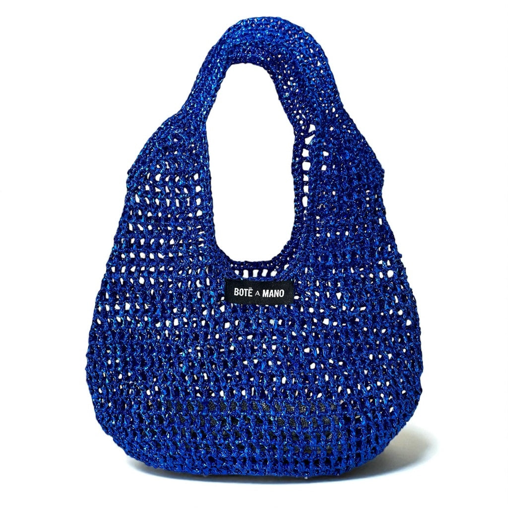 Blue woven handbag with 'Bote a Mano' label on a white background