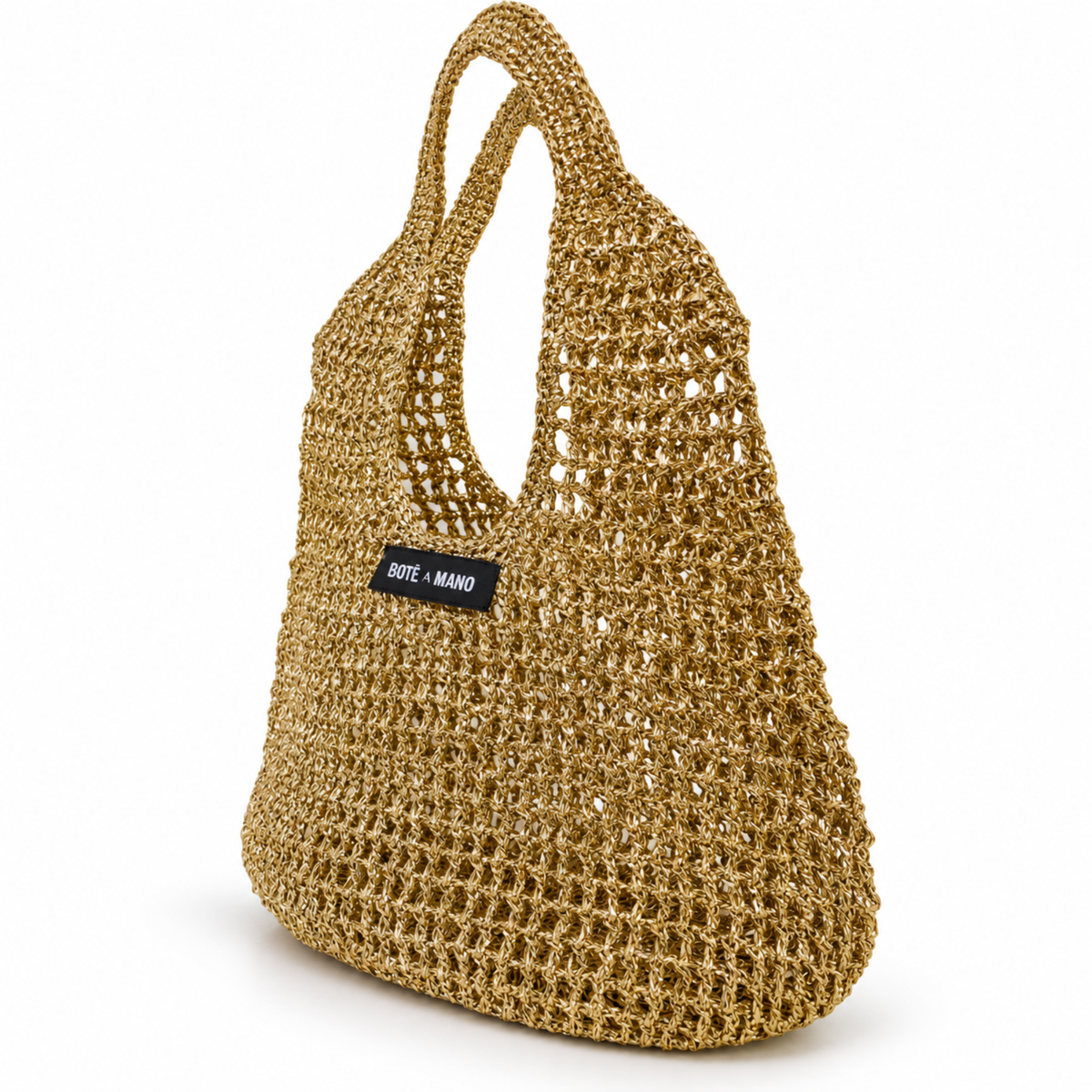 Side view of gold raffia top handle bag showing woven texture and structured shape, handcrafted by Bote A Mano.