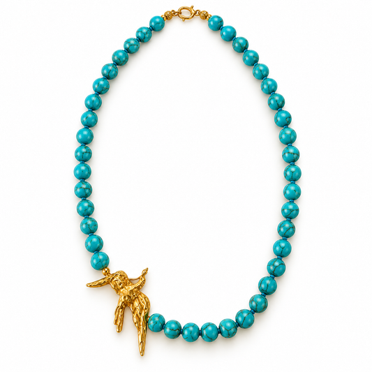 Turquoise beaded necklace with 24K gold-plated bird pendant by Bote A Mano