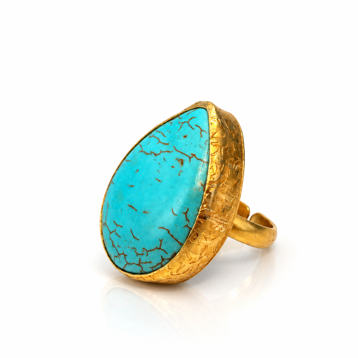 Paisley-shaped natural Turquoise statement ring with textured 24K gold-plated setting by Bote A Mano
