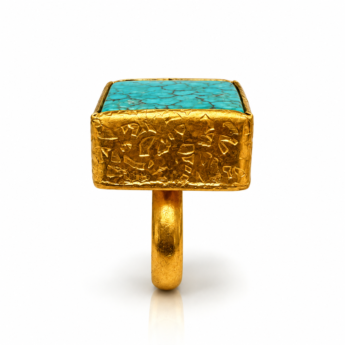Side view of Bote A Mano square Turquoise ring with textured 24K gold-plated setting