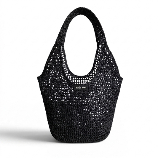 Black metallic raffia bag by Bote A Mano, handcrafted with a soft structure and textured woven finish.