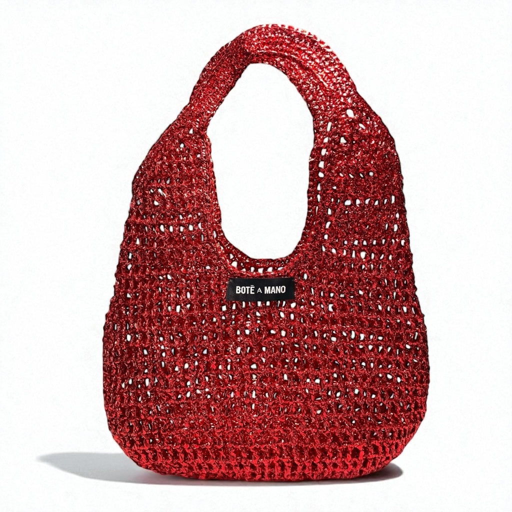 Red woven handbag with 'Bote a Mano' label on a white background