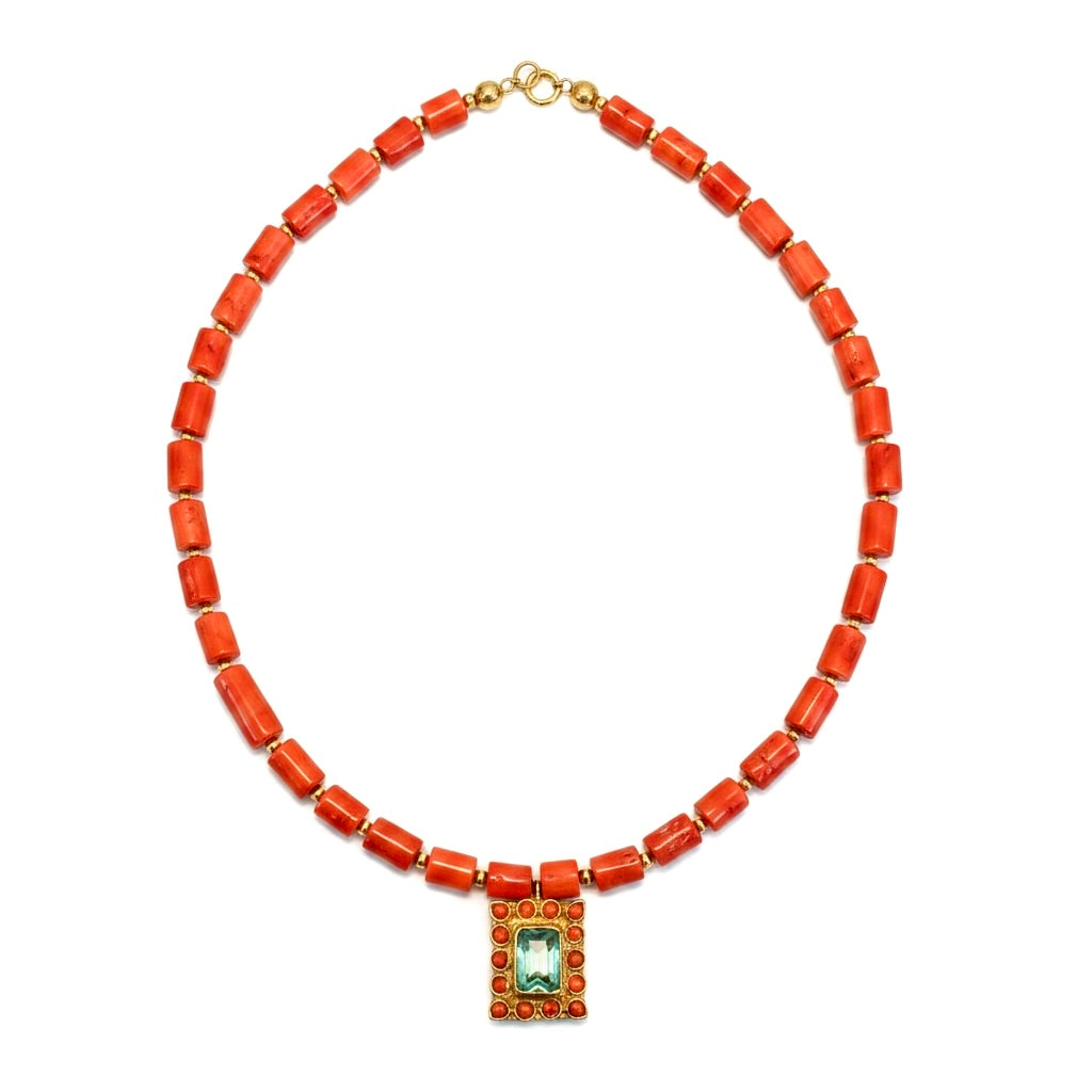Front view of coral and aquamarine pendant necklace by Bote A Mano with coral beads and 24K gold-plated setting.