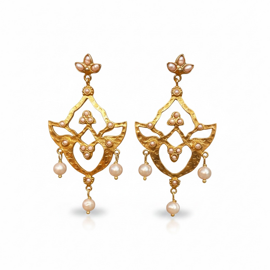 Front view of gold-plated pearl drop earrings by Bote A Mano, inspired by ancient Persian design with intricate detailing.