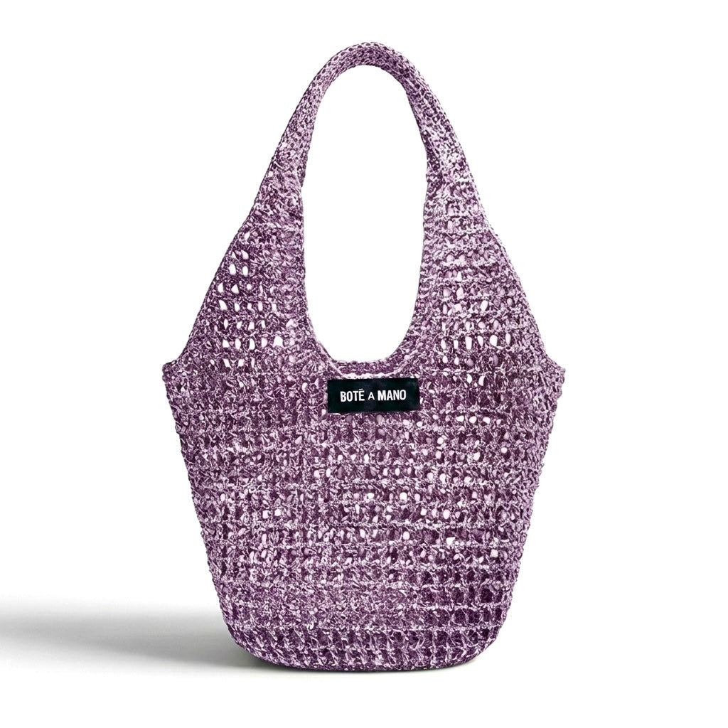Lilac metallic raffia bag by Bote A Mano, handcrafted with a soft structure and shimmering woven texture.