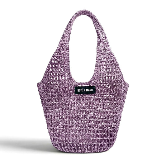 Lilac metallic raffia bag by Bote A Mano, handcrafted with a soft structure and shimmering woven texture.